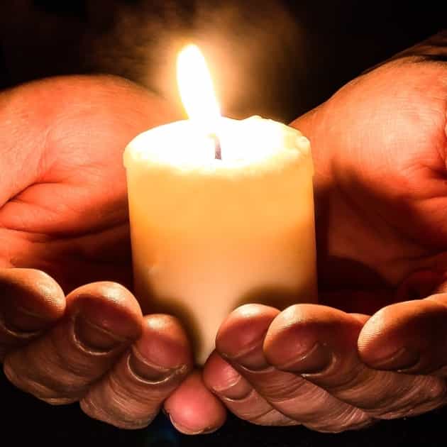 person holding candle. What is an Entrepreneur? Blazetrue article