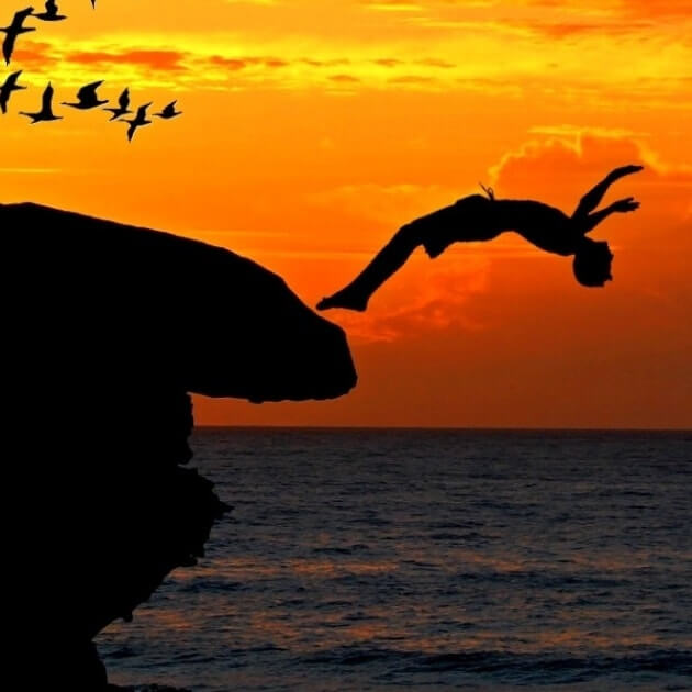 person diving off cliff. Why businesses fail. Blazetrue article