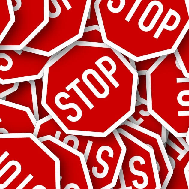 stop signs. choosing your business consultant - red
